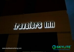 stainless sign travelers inn 1 1