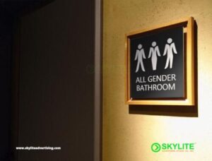 engraved metal all gender restroom sign with framed 1